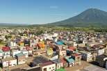 Discover a charming property nestled in a picturesque town, offering stunning views of a majestic mountain.