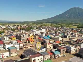 Discover a charming property nestled in a picturesque town, offering stunning views of a majestic mountain.