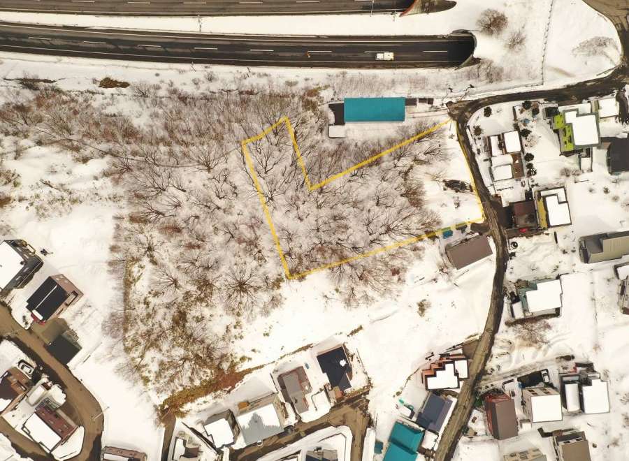 Discover a unique property nestled in a serene, snow-covered landscape.
