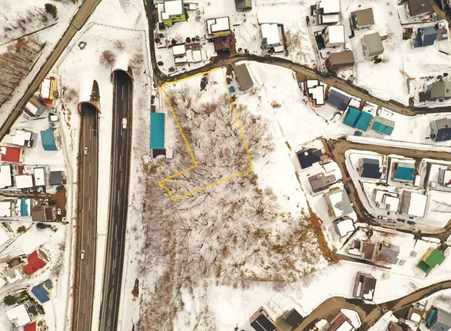 Discover a unique property nestled in a serene, snow-covered landscape.