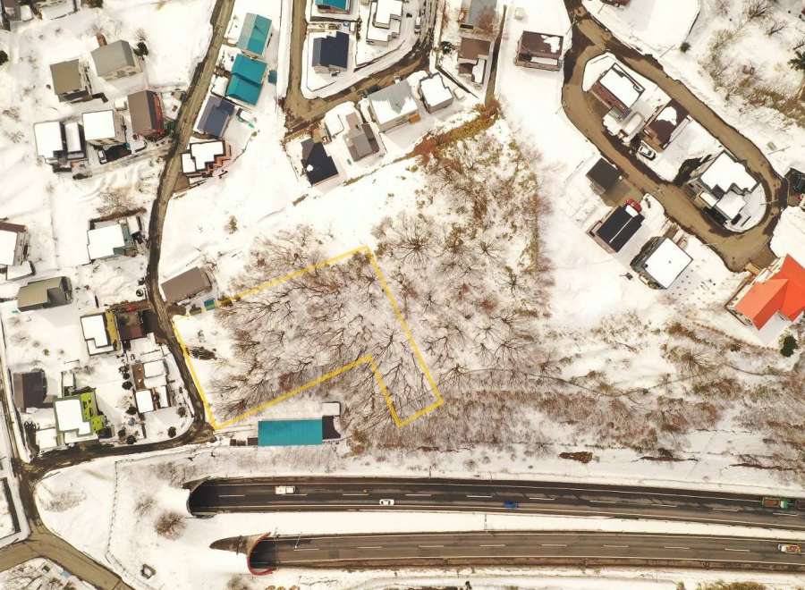 Discover a unique property nestled in a serene, snow-covered landscape.