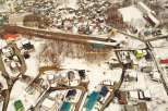 Discover a prime real estate opportunity in a picturesque, snow-covered town.