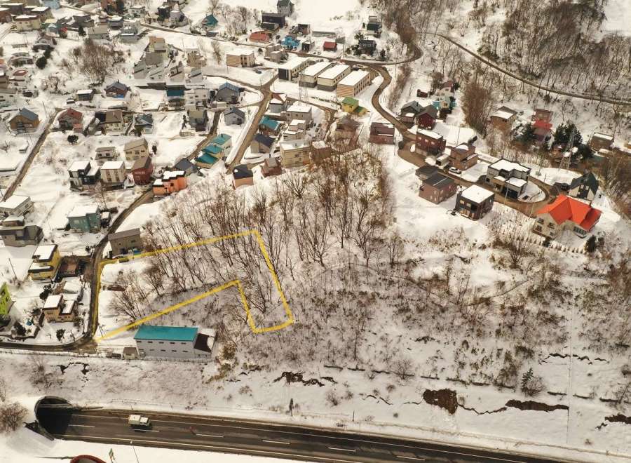 Discover a charming property nestled in a serene, snow-covered landscape.