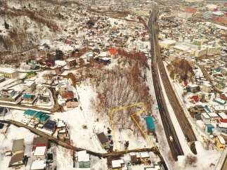 Discover a prime real estate opportunity in a serene, snow-covered landscape.