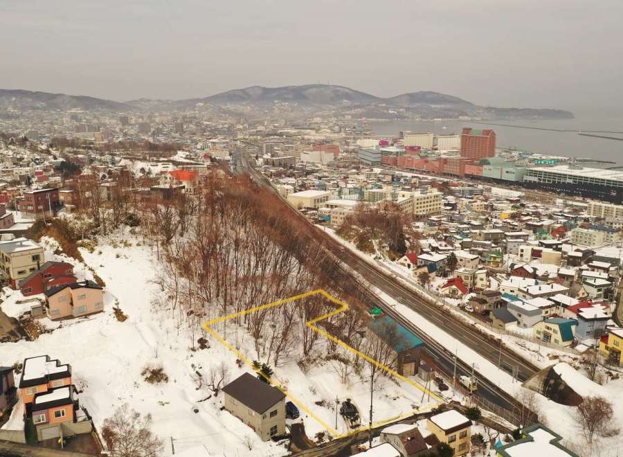 Discover a prime real estate opportunity in a picturesque winter landscape.