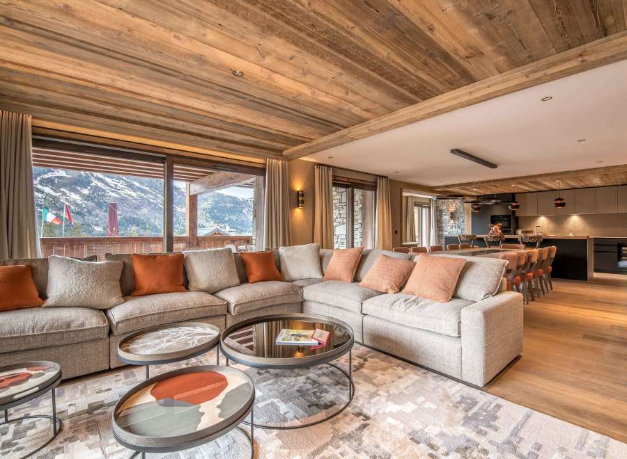 Experience luxury living in this stunning property, featuring a spacious living area with a cozy sectional sofa and a beautiful view.