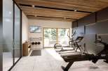 This luxurious home gym offers a serene workout experience with stunning views.