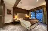 Luxurious chalet bedroom with stunning mountain views.