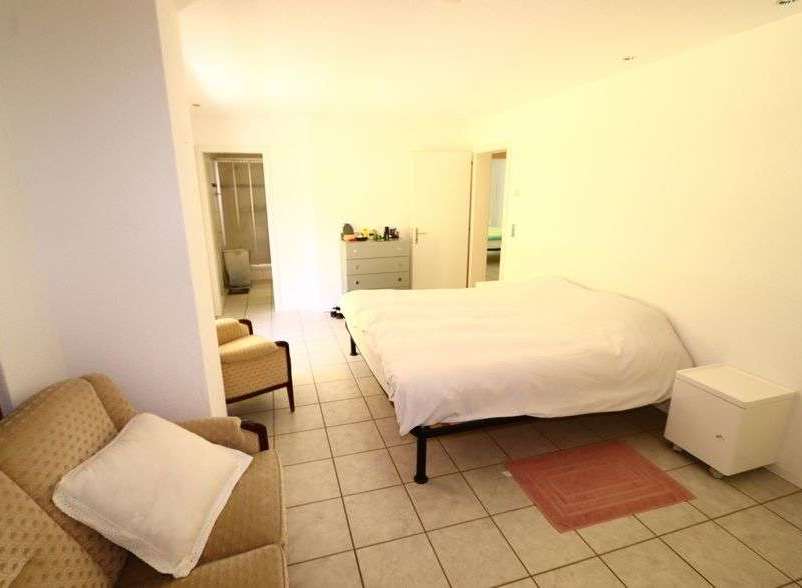 Discover a cozy bedroom with a comfortable bed and a relaxing atmosphere.