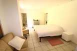 Discover a cozy bedroom with a comfortable bed and a relaxing atmosphere.