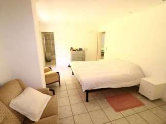 Discover a cozy bedroom with a comfortable bed and a relaxing atmosphere.