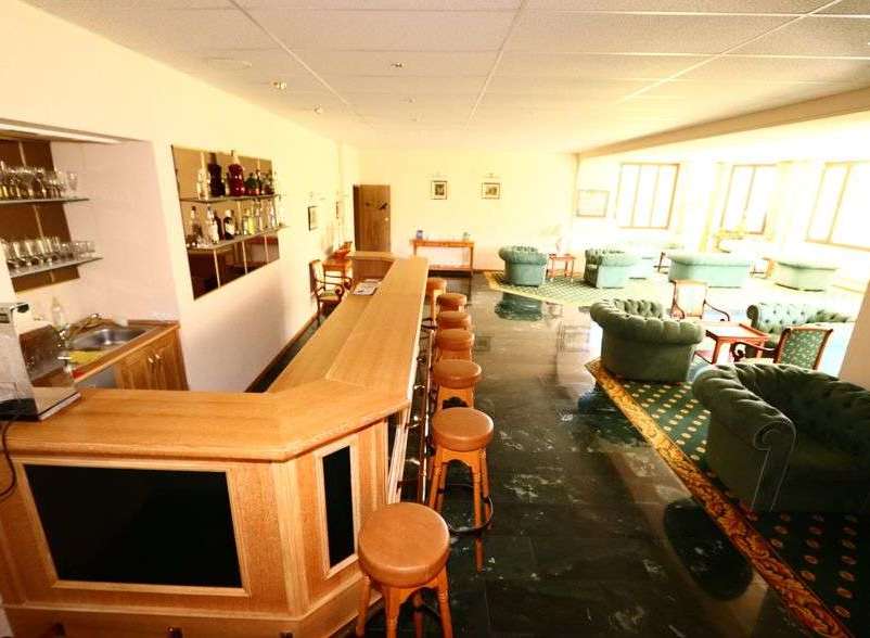 Step into a cozy bar area, perfect for relaxation and socializing.