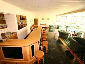 Step into a cozy bar area, perfect for relaxation and socializing.