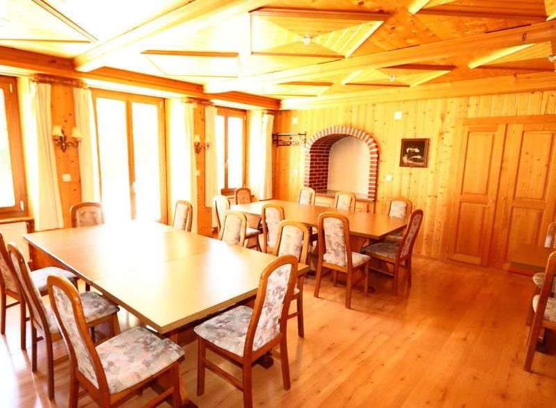 Step into a charming dining room with a warm, inviting ambiance.