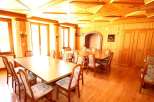 Step into a charming dining room with a warm, inviting ambiance.