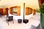 Charming chalet with traditional wooden shutters and windows.