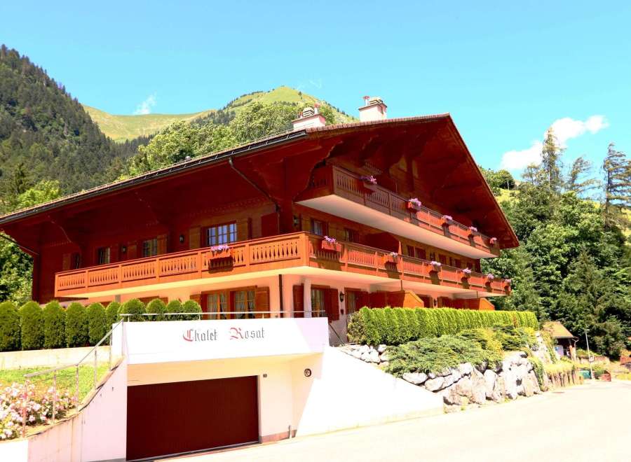 Discover the charm of Chalet Rosat, a stunning property nestled in a picturesque mountain setting.