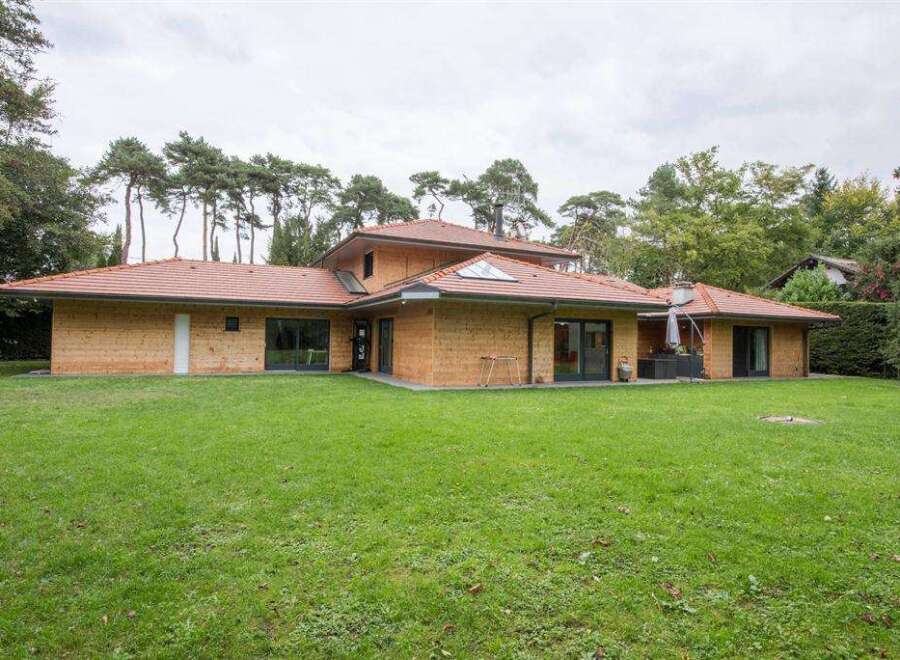 Stunning contemporary home nestled in a tranquil wooded setting.