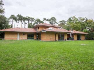 Stunning contemporary home nestled in a tranquil wooded setting.