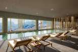 Indulge in luxury at this stunning property, featuring a serene indoor pool with breathtaking mountain views.