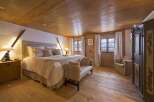 Experience rustic charm in this cozy bedroom.