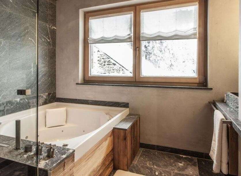 Indulge in the ultimate relaxation in this luxurious bathroom.