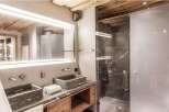 Experience luxury in this stunning bathroom featuring a sleek, modern design.