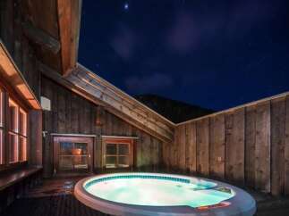 Enjoy a relaxing evening under the stars in this luxurious hot tub.