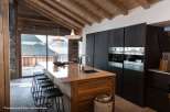 Experience luxury living in this stunning property, showcasing a modern kitchen with high-end appliances and a sleek design.