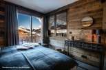 Experience the ultimate alpine retreat in this stunning bedroom.