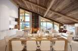 Experience luxury living in this stunning chalet, featuring a cozy fireplace and breathtaking mountain views.