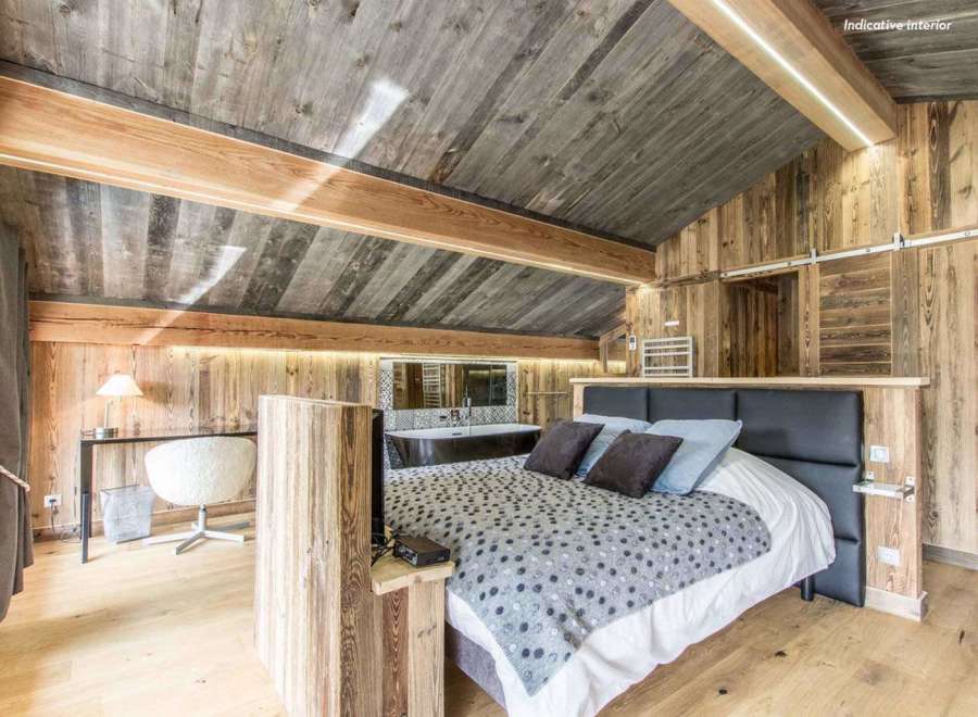 Experience rustic luxury in this stunning bedroom.