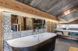 Experience rustic luxury in this stunning bathroom.