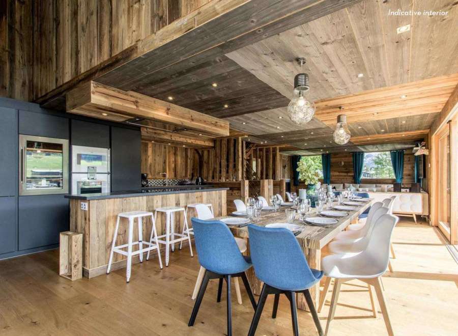 Experience rustic elegance in this stunning property, showcasing exquisite wooden interiors and a warm, inviting atmosphere.