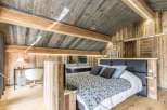 Experience rustic luxury in this stunning bedroom.