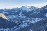Nestled in a picturesque mountain valley, this property offers stunning views of snow-covered peaks and a charming village.