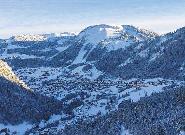 Nestled in a picturesque mountain valley, this property offers stunning views of snow-covered peaks and a charming village.