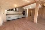 Discover the charm of this stunning property, featuring a modern kitchen with sleek cabinetry and integrated appliances.