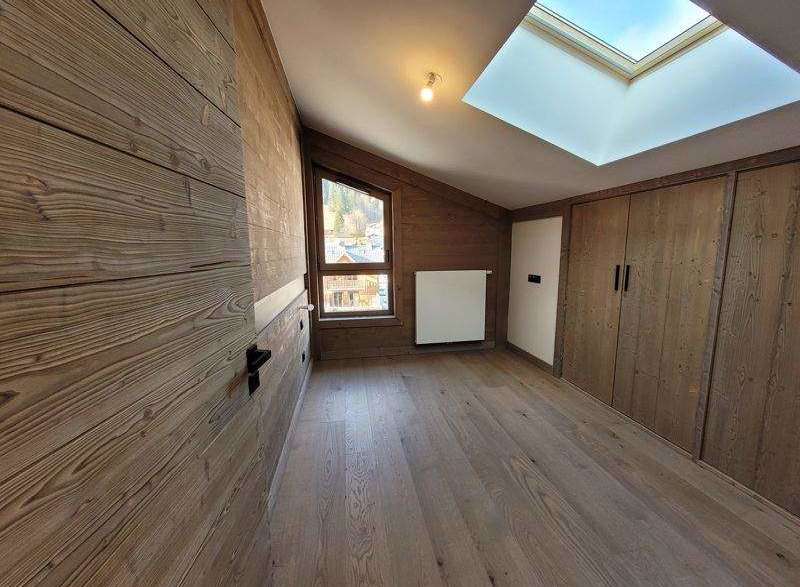This stunning room features beautiful wooden paneling and flooring, creating a warm and inviting atmosphere.