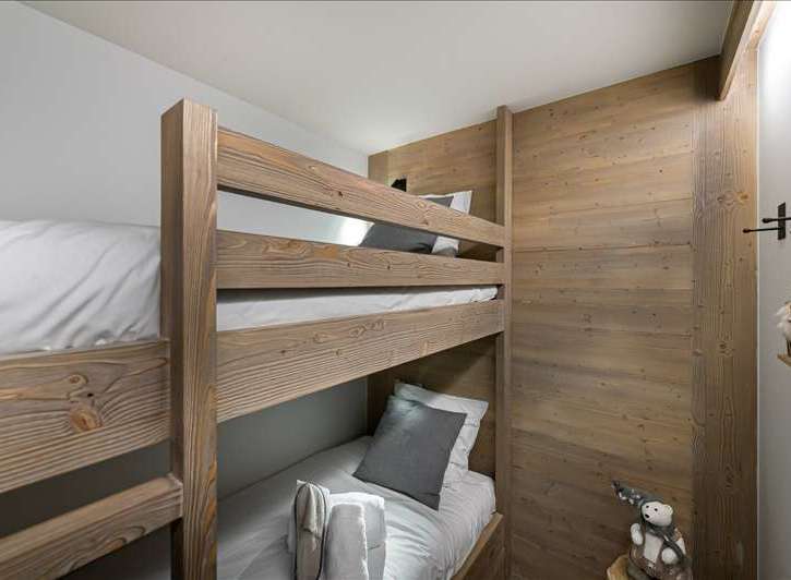 Cozy bunk beds offer a comfortable sleeping arrangement, perfect for families or groups.