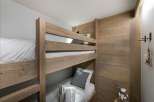 Cozy bunk beds offer a comfortable sleeping arrangement, perfect for families or groups.