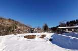 Discover a charming property nestled in a picturesque winter landscape.