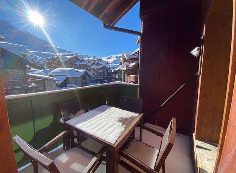 Enjoy breathtaking mountain views from this cozy balcony.