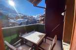 Enjoy breathtaking mountain views from this cozy balcony.