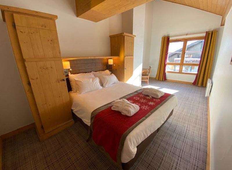 Experience cozy comfort in this charming bedroom.