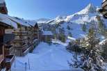 Enjoy breathtaking mountain views from this cozy ski chalet.