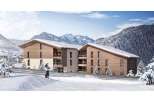 Discover your dream ski chalet! This stunning property boasts modern architecture with a warm, inviting wooden facade.