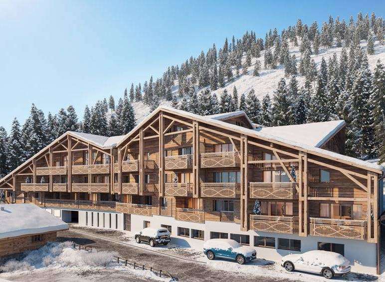 Discover the charm of this stunning wooden chalet nestled in a snowy landscape.