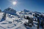 Experience the breathtaking beauty of a snow-covered mountain landscape.