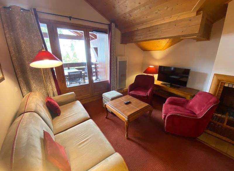 Cozy living room with a comfortable sofa and two armchairs, perfect for relaxing after a day of exploring.